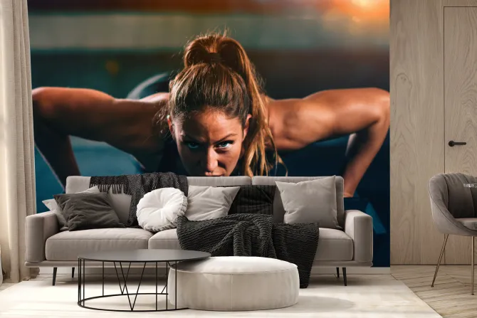 Fototapeta: Wysportowana kobieta robiąca pompki