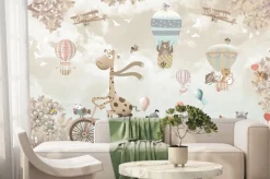 Fototapeta: Żyrafa i inne zwierzęta w pojazdach nad łąką