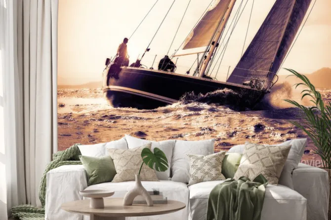 Naklejka: Żaglówka na morzu o zachodzie słońca