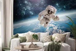 Naklejka: Astronauta w kosmosie na tle ziemi