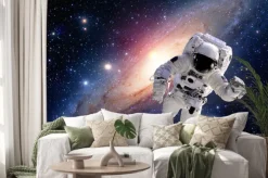 Naklejka: Astronauta w kosmosie na tle galaktyki