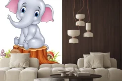 Naklejka: Cartoon zabawny słoniątka siedzi na pniu