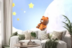 Naklejka: Cute little bear sitting on soft pastel clouds and watching beautiful