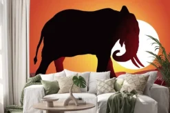 Naklejka: Czarna sylwetka słonia na tle słońca