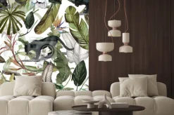 Naklejka: Czarne pantery wśród tropikalnych kwiatów i liści