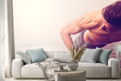 Naklejka: Człowiek robi push-up ćwiczenia z hantle. silny mężczyzna robi