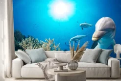 Naklejka: Delfin pod wodą na niebieskim tle oceanu