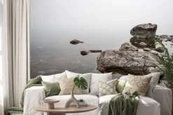 Naklejka: Fog above the water on a lake with large stones. clear water