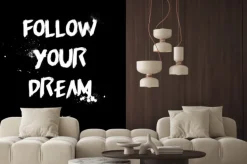 Naklejka: Follow your dream quotes tshirt design. brush stroke font style.