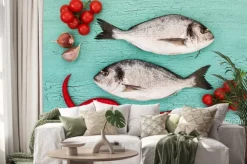 Naklejka: Fresh dorado ryba z warzywami na niebieskim stole. kopia przestrzeń,