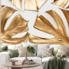 Naklejka: Golden monstera leaves on white background