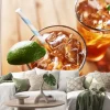Naklejka: Iced sweet tea with lime wedges and retro paper straw shot from
