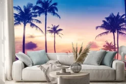Naklejka: Letni krajobraz palmy na tle kolorowego nieba o zachodzie słońca