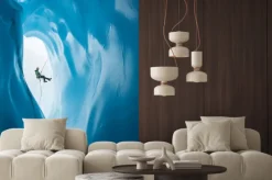 Naklejka: Mężczyzna rappelling obok otwarcia blue ice jaskini na lodowiec