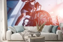 Naklejka: Młodzi mężczyźni z muskularnym ciałem za pomocą roweru powietrznego