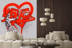 Naklejka: Młodzieniec pisze słowo "love"