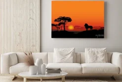 Obraz: Afrykański krajobraz z lwa zwierząt sylwetki. savanna tle zachodu