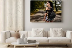 Obraz: Beautiful girl brunette with backpack behind back in which roller