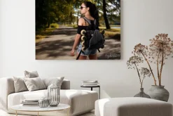 Obraz: Beautiful girl brunette with backpack behind back in which roller