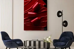 Obraz: Broken red lipsticks over smudged lipstick background