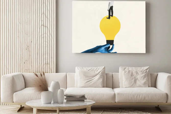 Obraz: Female blue hand holding electric bulb as idea symbol with young