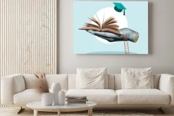 Obraz: Książka otwarta na dłoni symbol edukacji