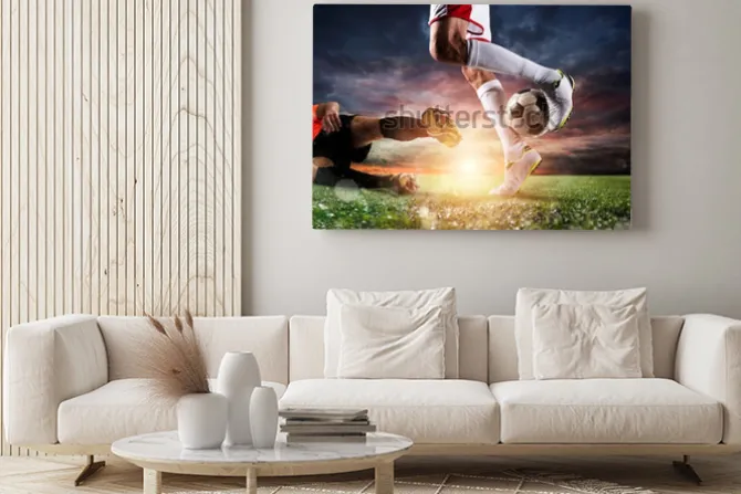 Obraz: Piłkarze z piłką na stadionie podczas meczu