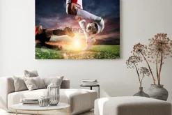 Obraz: Piłkarze z piłką na stadionie podczas meczu