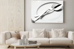 Obraz: Widelec i łyżka na białym talerzu