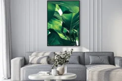 Plakat: Abstract tropical green leaves pattern on white background, lush