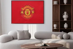 Plakat: Herb klubu manchester united na czerwonym tle