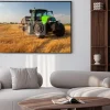 Plakat: Modern green tractor on agricultural field during harvest on