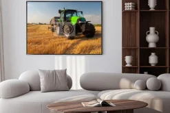 Plakat: Modern green tractor on agricultural field during harvest on