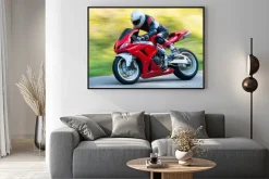 Plakat: Motocyklista jadący na motorze