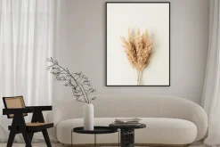 Plakat: Reeds foliage branches bouquet on neutral pastel beige background.