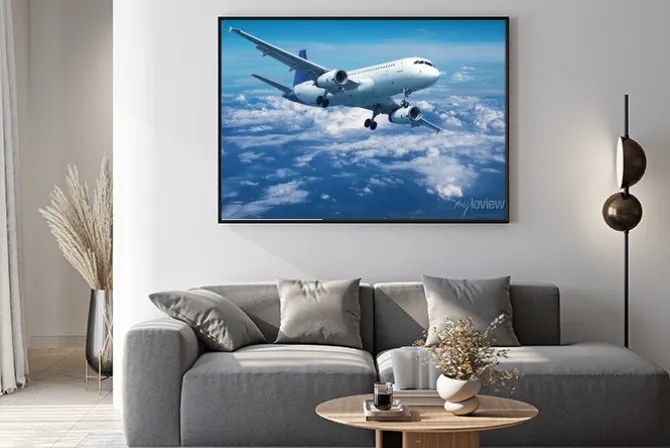 Plakat: Samolot pasażerski ponad chmurami