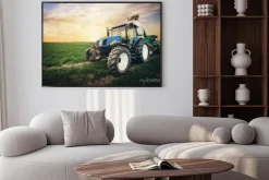 Plakat: Traktor na polu i zachód słońca